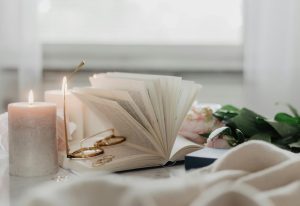 book and glasses with tranquil candles